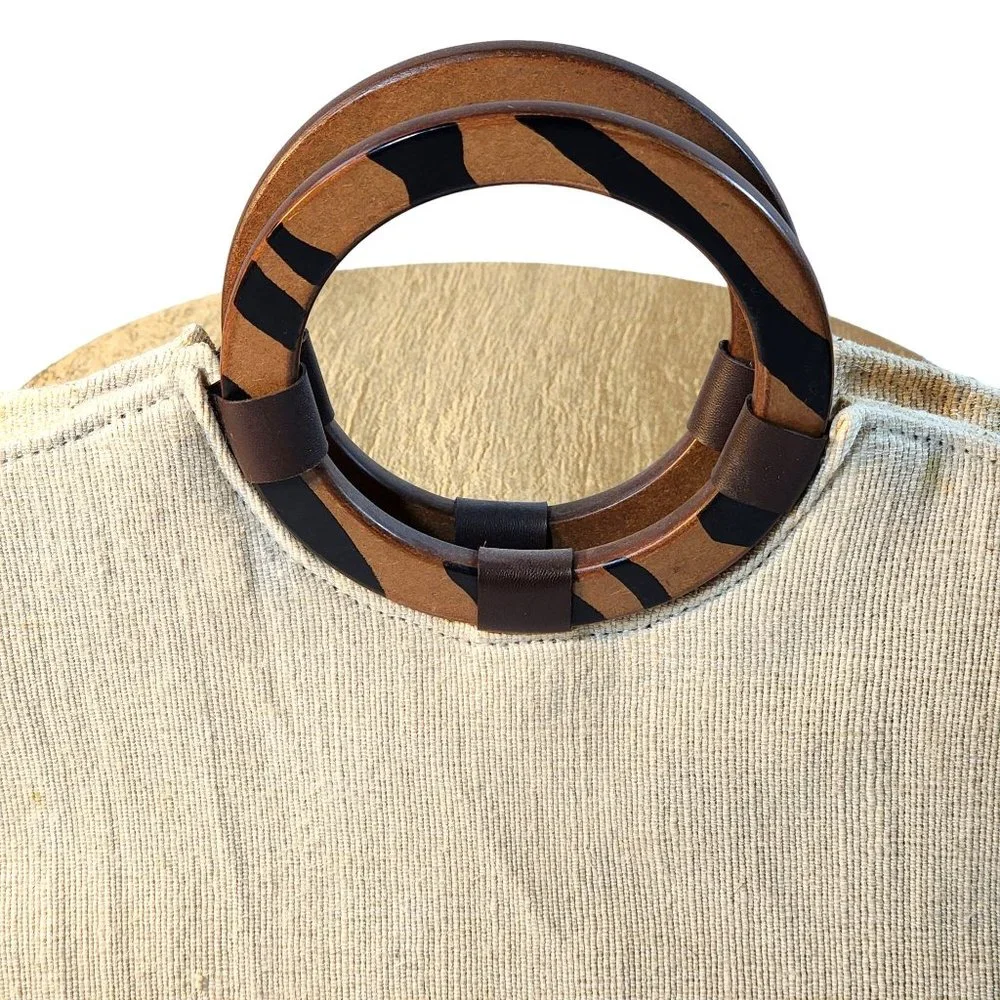 Beige Woven Handbag With Brown Accent at Bottom and Brown Decorative Wood handle